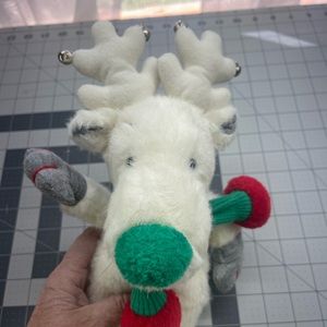 White w/green nose reindeer with red and green scarf. Vintage applause snowbell